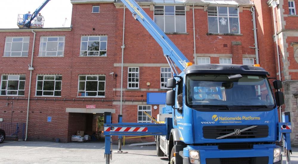 Cherry picker access for roof survey.